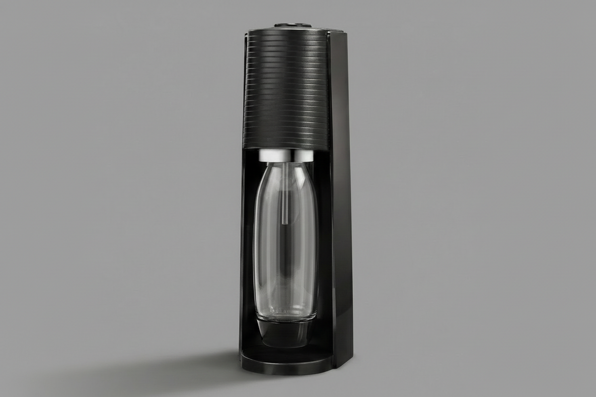 Black Sodastream sparkling water maker on a gray background