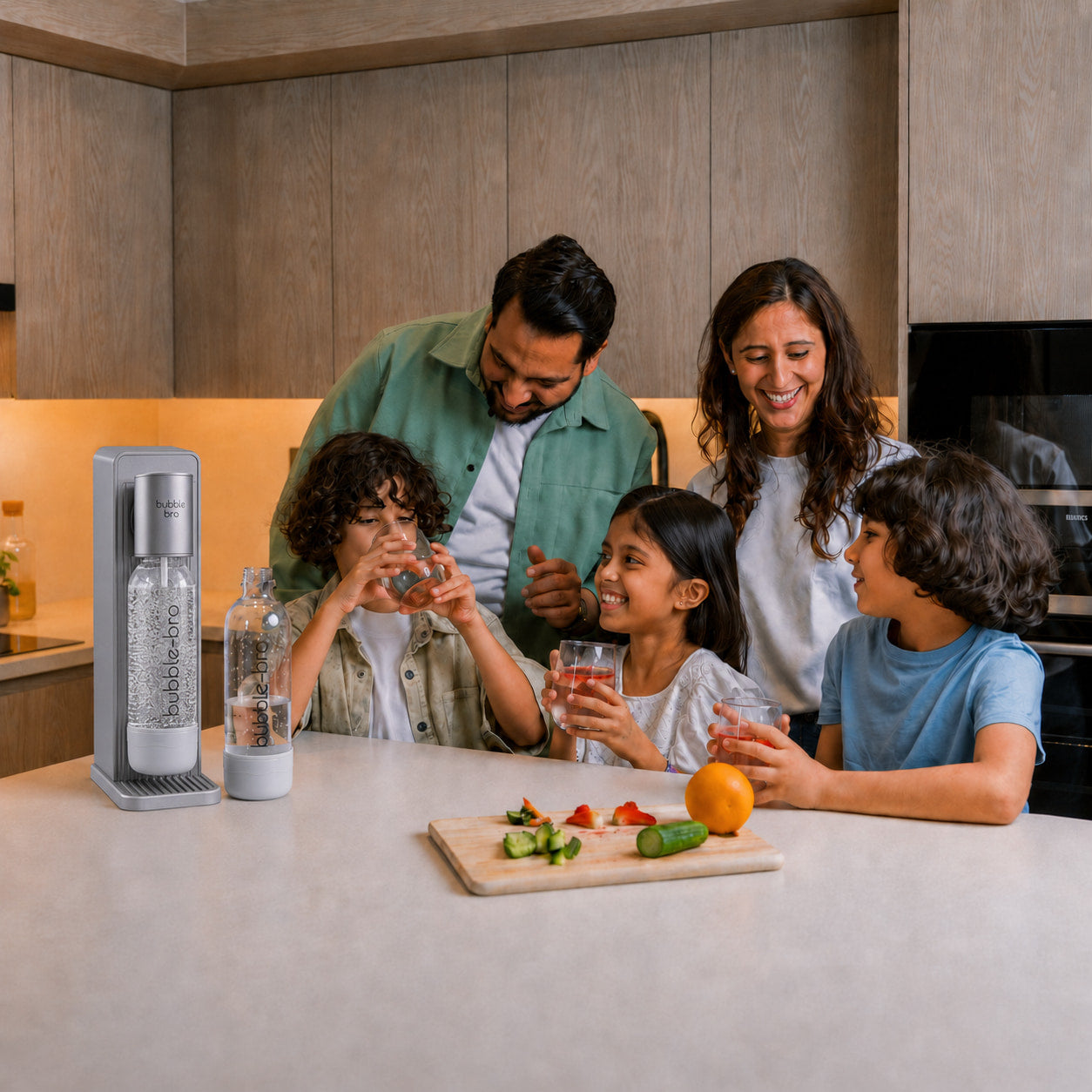 Family of five enjoying homemade sparkling water with fresh fruit in their kitchen - bubblebro Origin in black with two carbonating bottles 